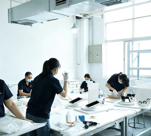 Cleanroom assembly line and manual inspection of acrylic display components